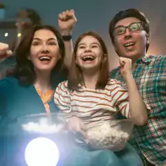 happy-family-watching-projector-4WQSA36.png